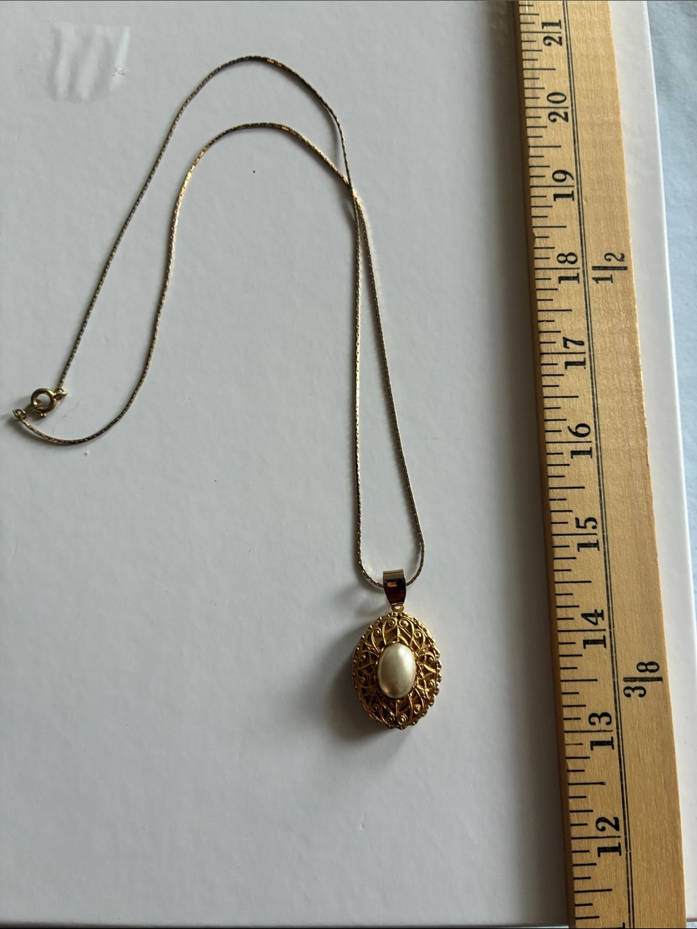 Gold-Tone Filigree Locket Pendant Necklace with Cream Cabochon
